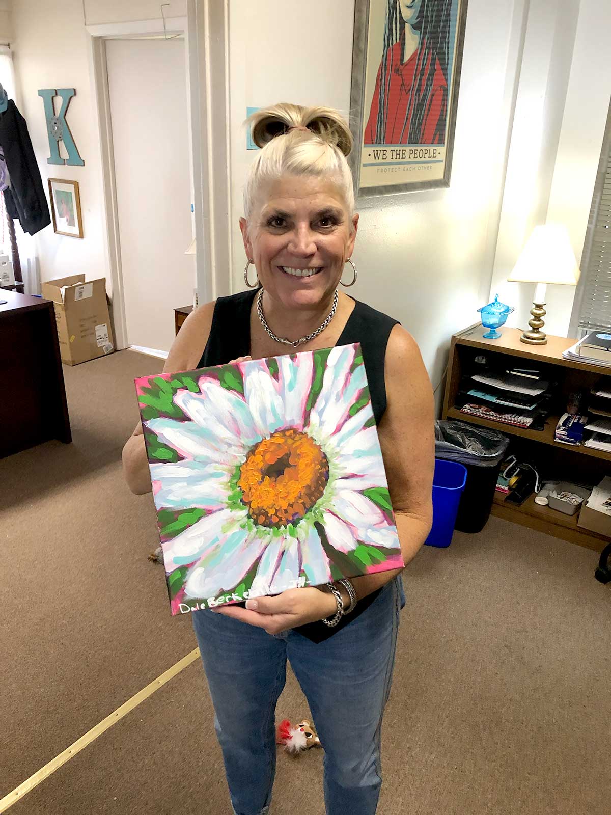 Happy art buyer of Dale Berkebile's Bold Daisy painting.