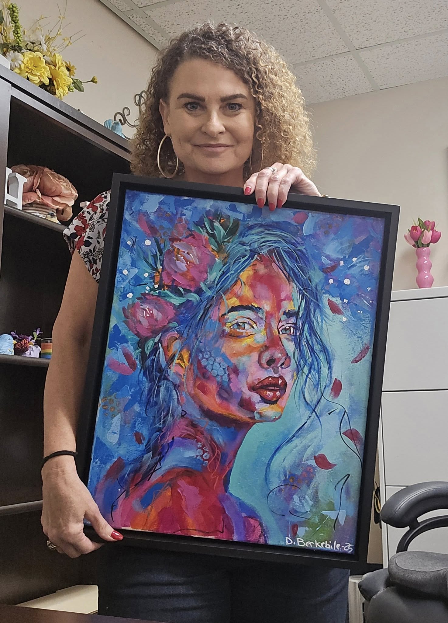 Carla holding Soul Boom painting.